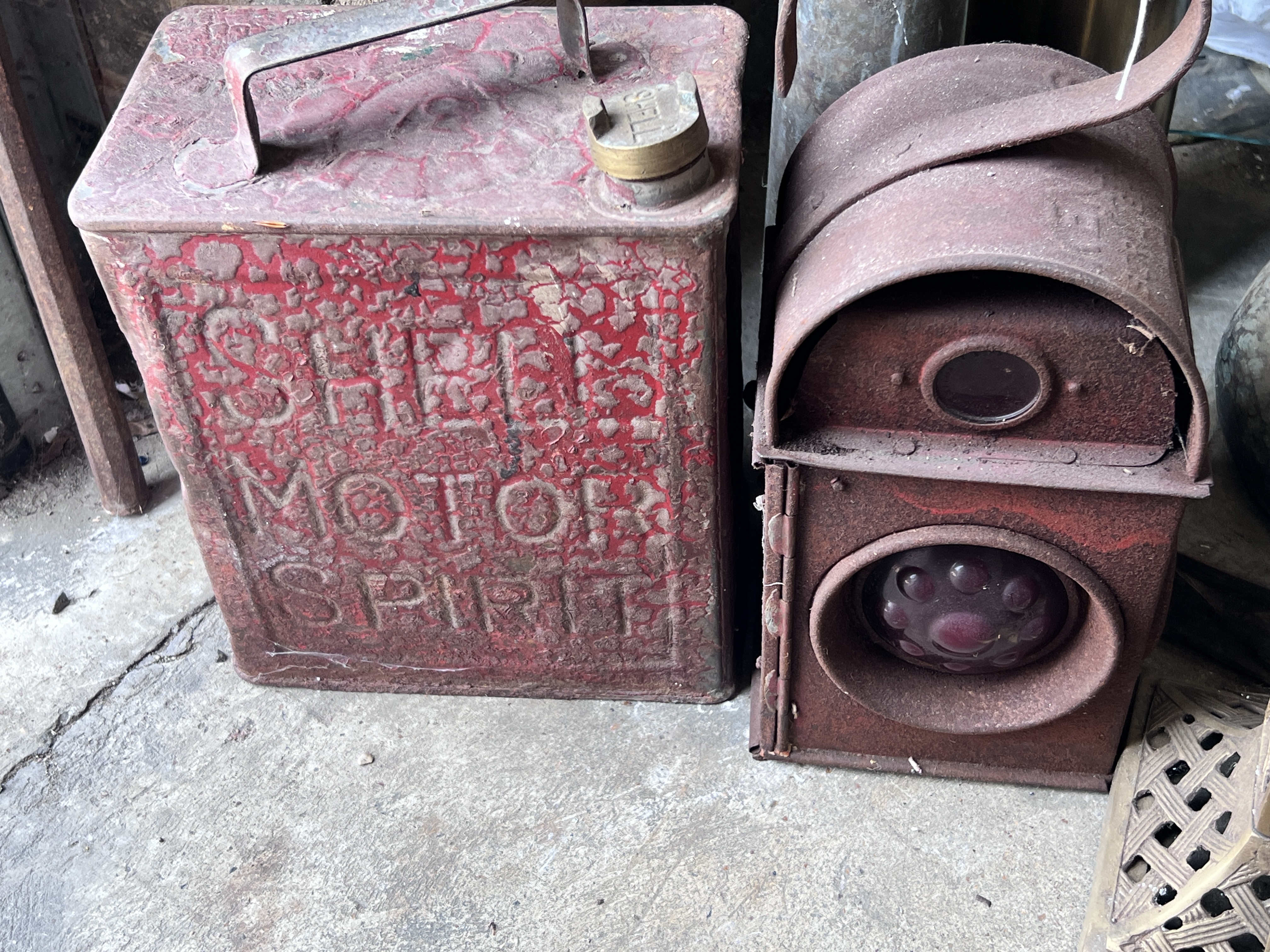 A vintage Shell petrol can, a road lamp, two shell cases and two brass lidded holders